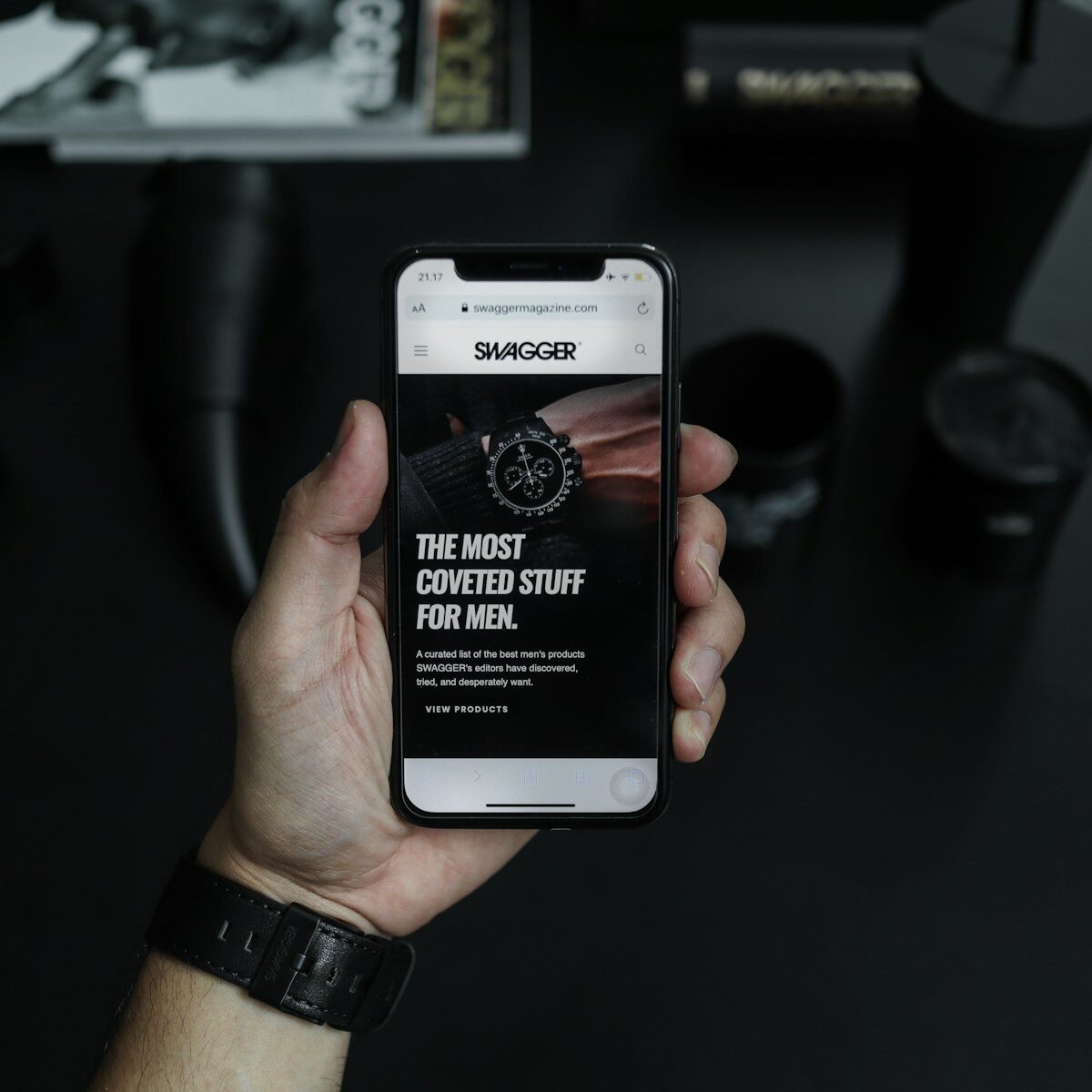 Photo by Drew Williams black smartphone displaying the most coveted stuff for men text